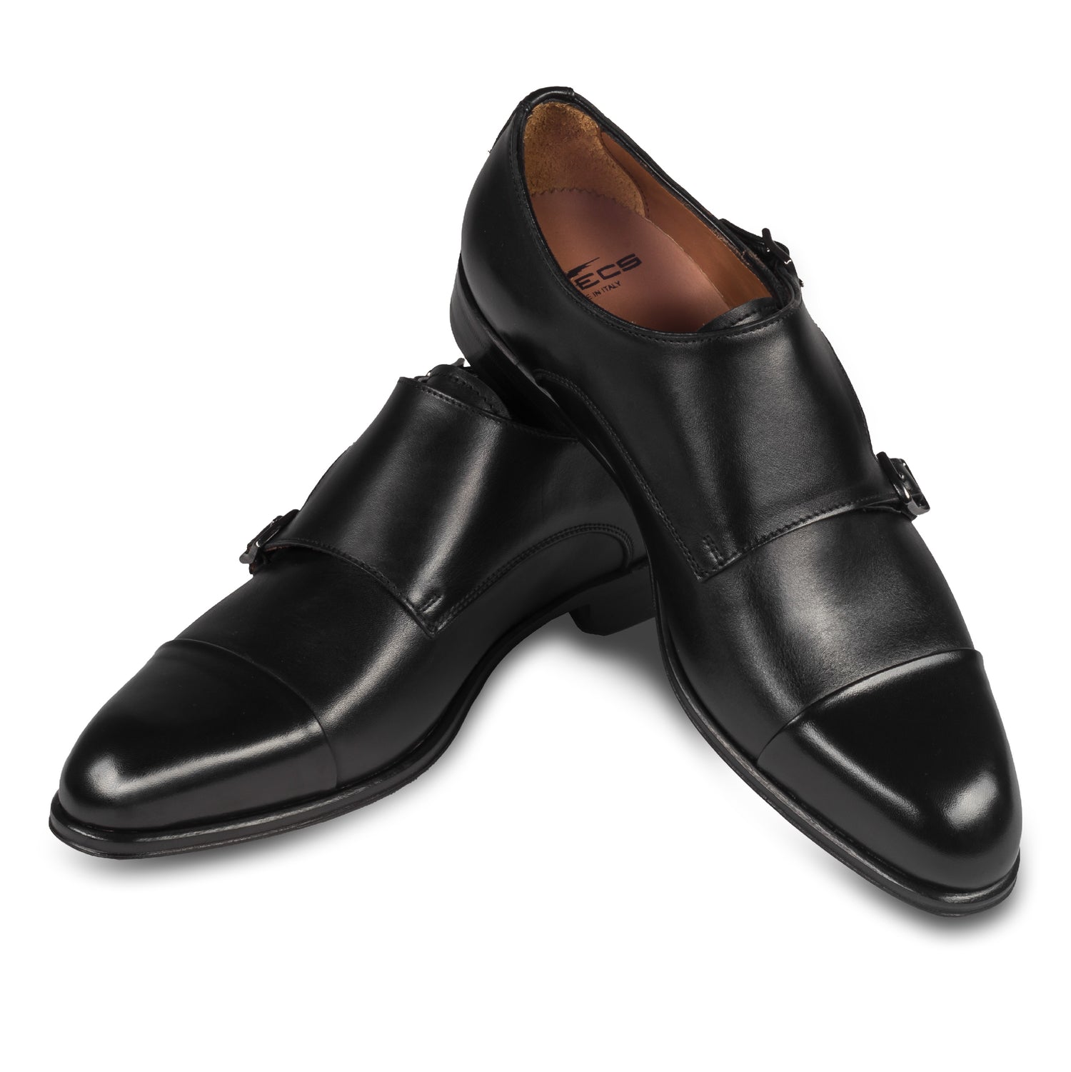 Double Monk Anzugschuh von Flecs, in schwarz, durchgenäht. Paarweise Ansicht Schuhe überkreuzt aufgestellt. Bei Sisento.
